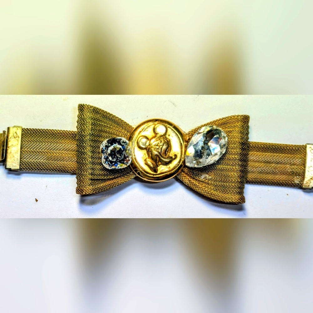 Wendy Gell Disney Mesh Gold Bracelet With Bow Two Swarovski Stones In Crystal.
